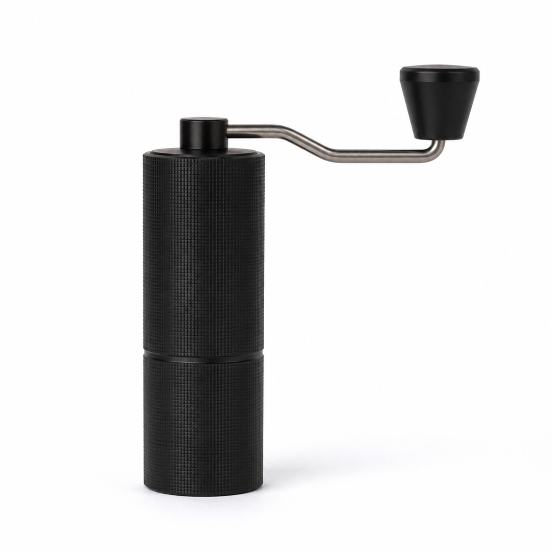 Black JavaPresse manual burr coffee grinder on a white background